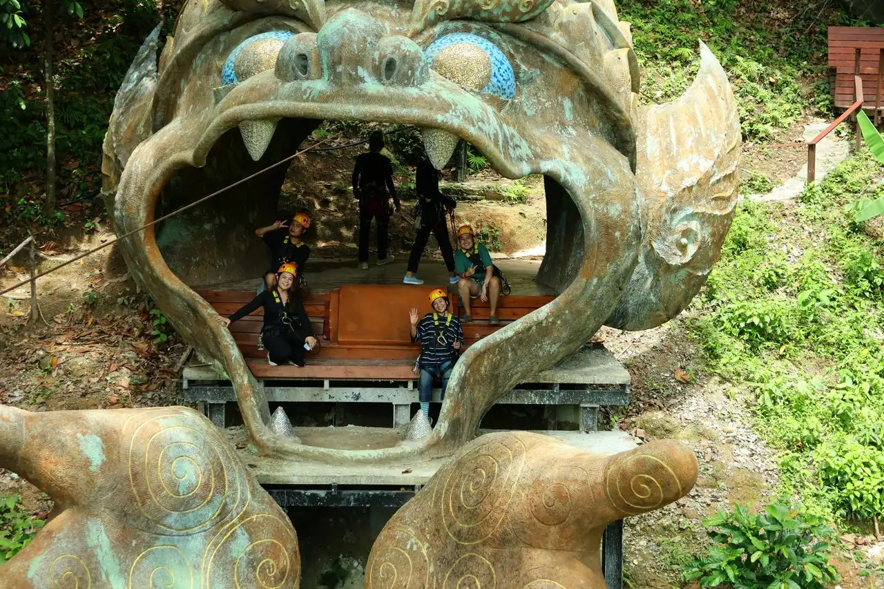 Guests posing inside the large Hanuman sculpture at Flying Hanuman